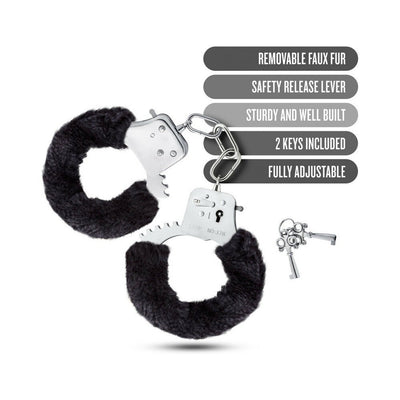 Black faux fur covered metal handcuffs with two keys and safety release lever, fully adjustable and sturdy design.