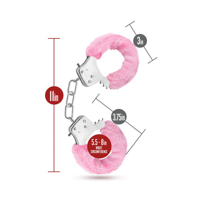 Pink faux fur covered metal cuffs with chain, showing dimensions and wrist circumference for adjustable fit.