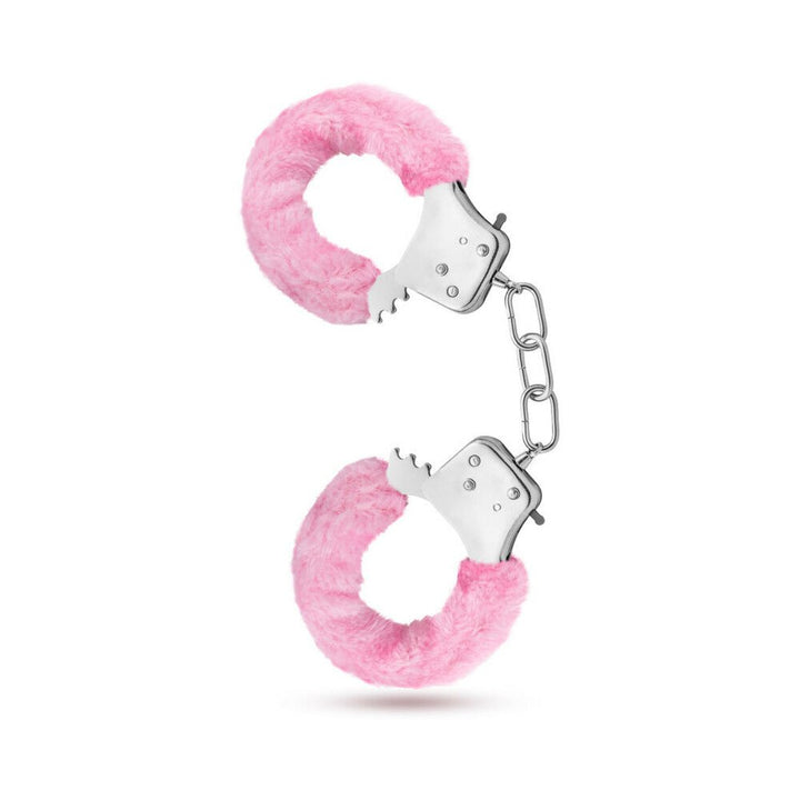 Pair of metal handcuffs covered in soft pink faux fur with a short connecting chain and locking mechanism.
