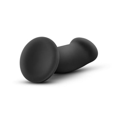 Black silicone G-spot dildo with curved shape and wide suction cup base for hands-free use.