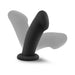 Black silicone G-spot dildo with curved tip and suction cup base casting shadow on white background.