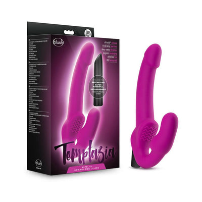 Pink strapless silicone dildo with ergonomic design and vibrating bullet, shown next to its black and purple packaging box.