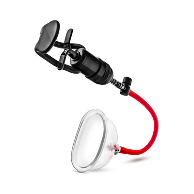 Professional-grade intimate pump with clear acrylic cup, red silicone hose, and black hand pump for controlled suction.