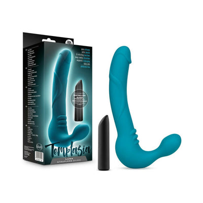 Teal Temptasia Luna strapless silicone dildo with black vibrating bullet and product packaging.