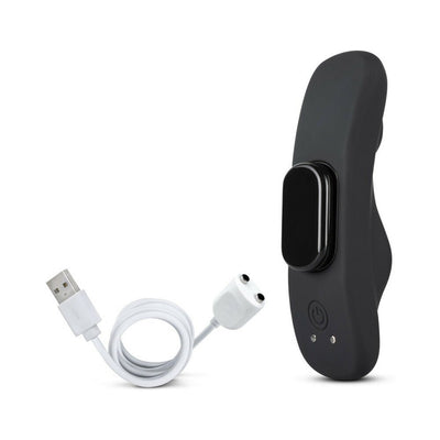 Black silicone remote control panty vibrator with USB magnetic charging cable on white background.
