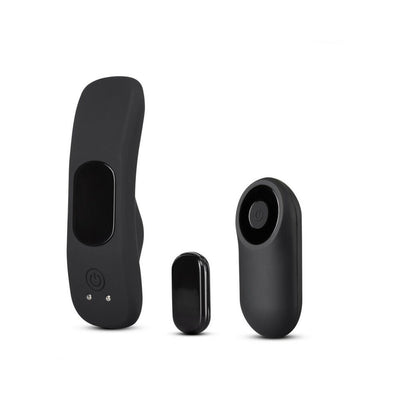 Black silicone wearable panty vibrator with matching compact remote control and small accessory piece.