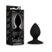 Black silicone Temptasia Slut Butt Plug with tapered tip and round base next to its sleek black packaging.