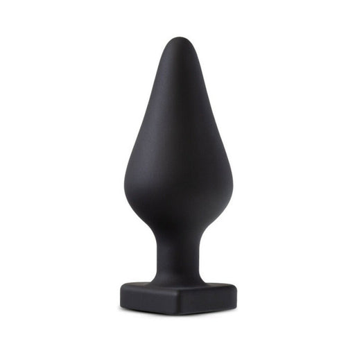 Black silicone tapered butt plug with a square base, designed for comfortable and secure wear.
