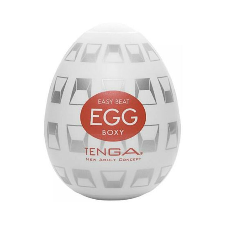 Compact white Tenga EGG Boxy with geometric gray patterns and red logo on front.
