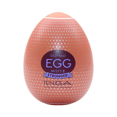 Tenga EGG Misty II in peach with silver pattern and bold label, compact and egg-shaped adult product packaging.