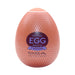 Tenga EGG Misty II in peach with silver pattern and bold label, compact and egg-shaped adult product packaging.