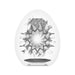 Close-up of the white Tenga EGG Shiny II interior showing its intricate sunburst textured pattern for enhanced stimulation.