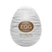 Compact white Tenga Egg Silky 2 with silver swirl design and gold label on front.