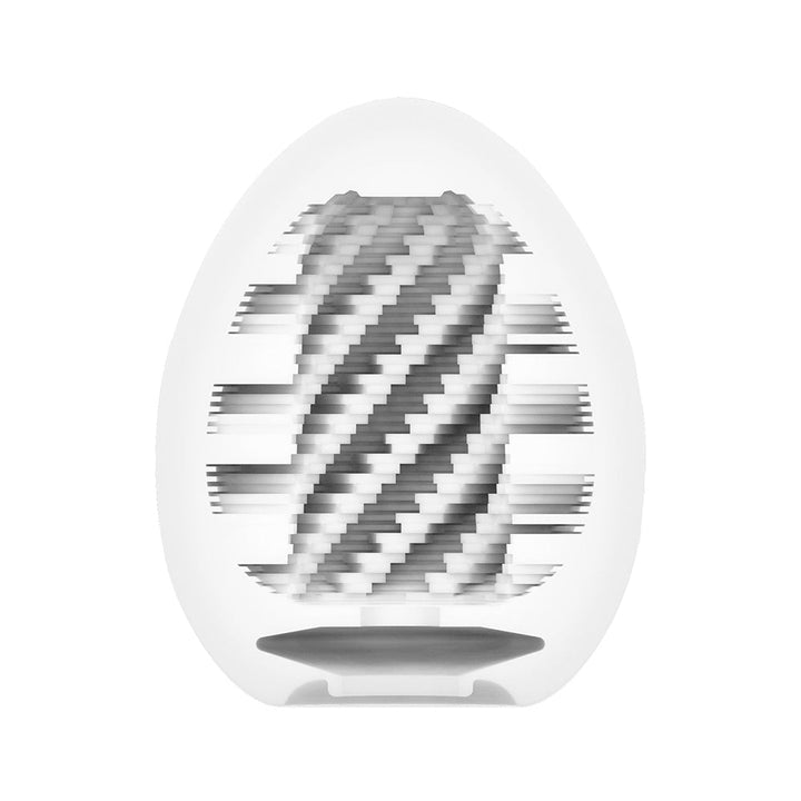 Close-up of Tenga EGG Spiral showing its textured spiral internal design in a translucent egg-shaped casing.