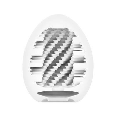 Close-up of Tenga EGG Spiral showing its textured spiral internal design in a translucent egg-shaped casing.