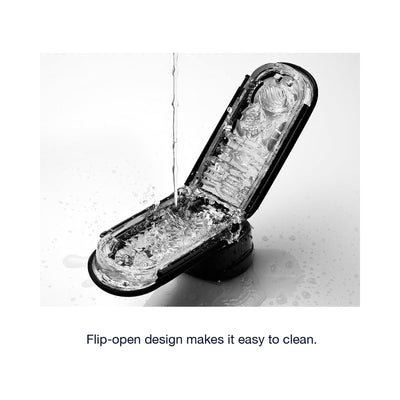 Tenga FLIP ZERO Black male pleasure device shown open with water pouring inside for easy cleaning demonstration.