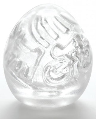 Clear Tenga Keith Haring Easy Beat Egg with embossed street art-inspired design on a white background.