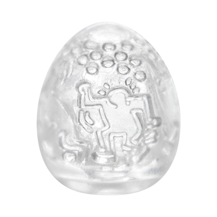 Clear Tenga Keith Haring Egg Dance Stroker with embossed dancing figure design on the surface.