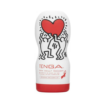 Tenga Original Vacuum Cup with Keith Haring artwork featuring two figures holding a red heart on a white and red container.