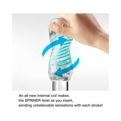 Hand holding a transparent Tenga Spinner Pixel with blue arrows illustrating its twisting internal coil mechanism.
