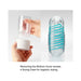 Hands removing the bottom cover of the Tenga Spinner Pixel to reveal a clear drying case for hygienic drying.