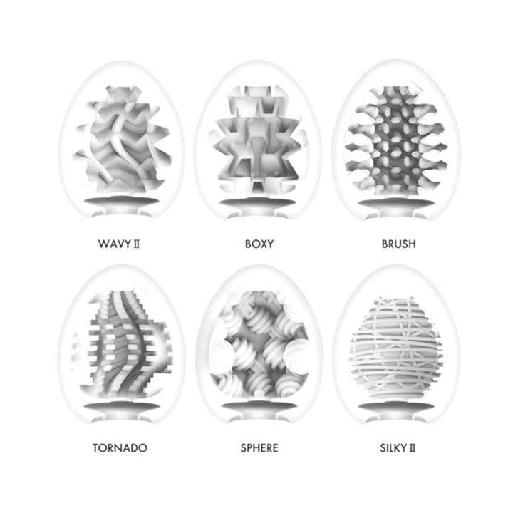 Cross-section views of six Tenga Egg strokers showing unique internal textures labeled Wavy II, Boxy, Brush, Tornado, Sphere, and Silky II.