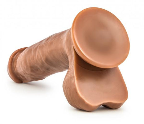 Realistic Latin brown dildo with suction cup base and detailed texture for versatile use.