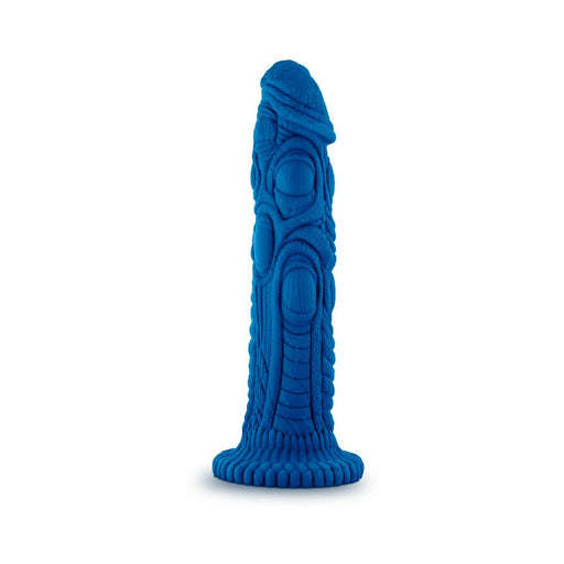 Blue silicone dildo with intricate dragon scale texture and flared base, standing upright on a white background.
