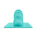 Turquoise silicone attachment with textured bumps and smooth contours designed for premium machine stimulation.