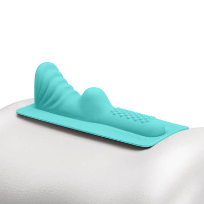 Turquoise silicone attachment with textured bumps and smooth contours designed for The Unicorn and Cowgirl machines.