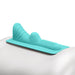 Turquoise silicone attachment with textured bumps and smooth contours designed for The Unicorn and Cowgirl machines.