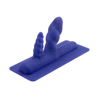 Blue silicone double penetration attachment with dual textured shafts on a flat base plate.