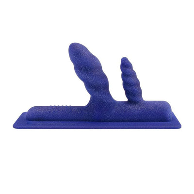 Blue silicone double penetration attachment with textured swirly heads and sparkle finish on a flat base.
