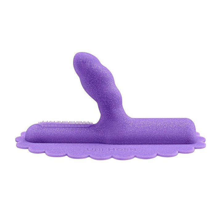 Purple silicone Uni Horn attachment with angled textured head and base for targeted stimulation and machine compatibility.