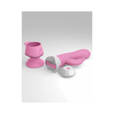 Pink multi-function rabbit vibrator with suction cup base and wireless remote on white background.