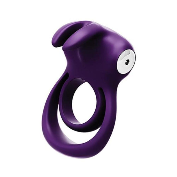 Purple silicone dual cock ring with contoured design and white control button, designed for shared pleasure and vibration.