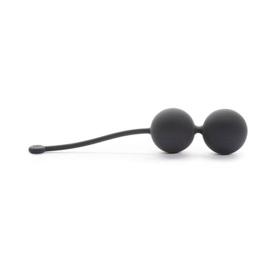 Black silicone Kegel balls with a flexible retrieval cord designed for pelvic floor strengthening exercises.