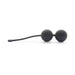 Black silicone Kegel balls with a flexible retrieval cord designed for pelvic floor strengthening exercises.