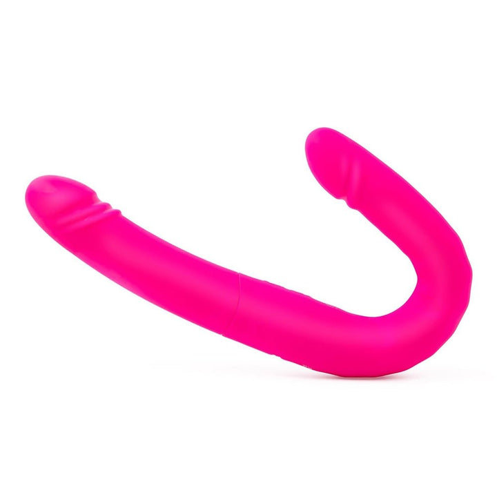 Bright pink flexible silicone dual-ended intimate toy with smooth and textured tips designed for shared stimulation.