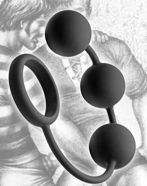 Black silicone cock ring with three smooth weighted balls connected by a flexible cord, set against a vintage artwork background.