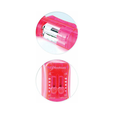 Close-up of pink Total Ecstasy Triple Stimulator vibrator showing battery compartment and control switches.
