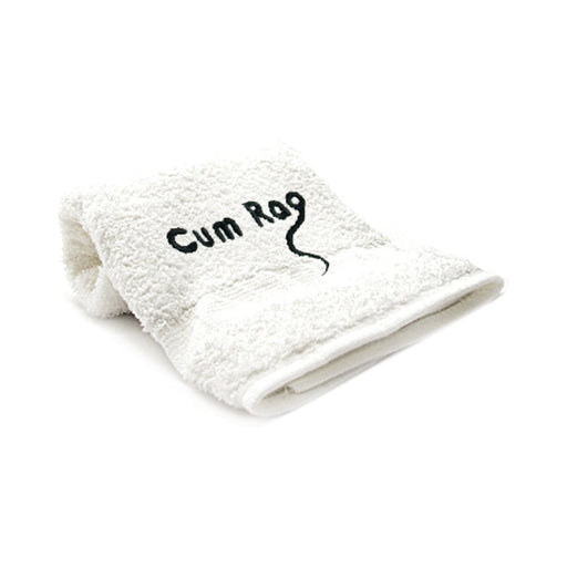 White folded towel with black embroidered text Cum Rag and a small graphic detail on a plain background