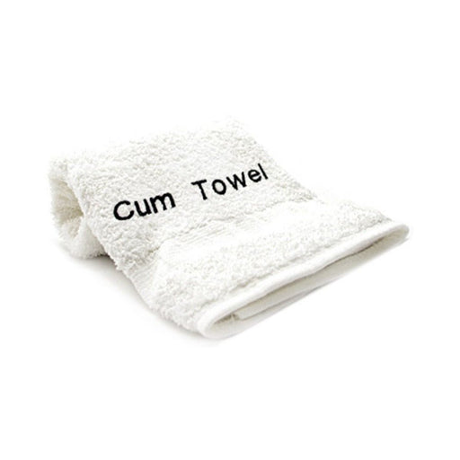 White folded towel with the words Cum Towel embroidered in black thread