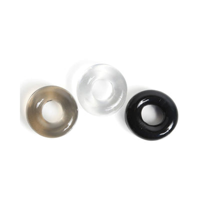 Set of three thick, donut-shaped cock rings in black, clear, and smoke colors on a white background.