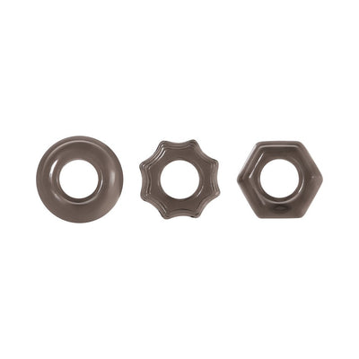 Set of three thick smoke-colored cock rings in circle, star, and hexagon shapes on white background.