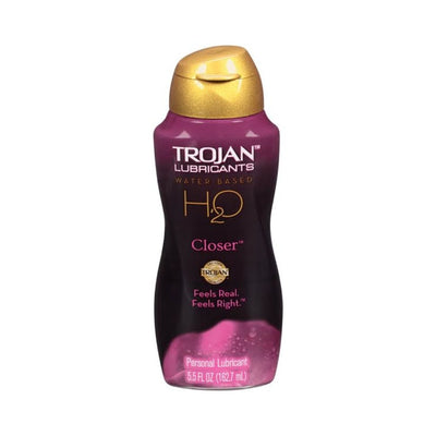 Bottle of Trojan H2O Closer water-based personal lubricant in 5.5 oz size with purple and gold packaging.