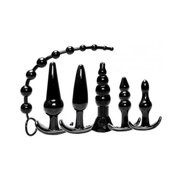 Set of six black anal plugs and beads in various graduated shapes and sizes with flared bases for safe use.