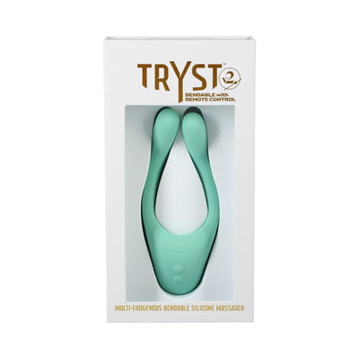 Tryst V2 bendable multi-erogenous silicone massager in teal with remote control, displayed in white retail packaging.