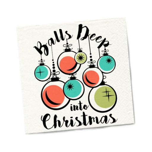 Christmas napkin with colorful hanging ornaments and playful "Balls Deep into Christmas" text design.