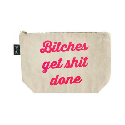 Beige cotton canvas pouch with bold pink "Bitches get shit done" text and gold zipper, perfect for daily essentials.